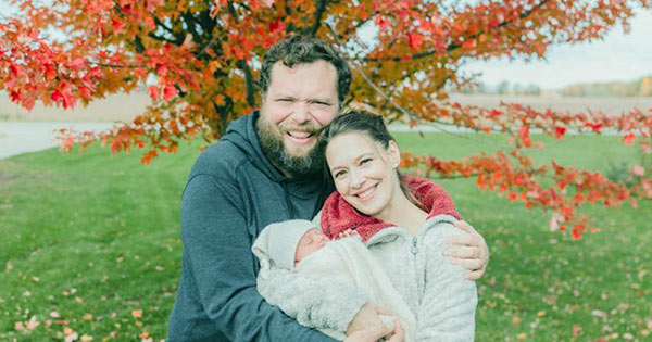 Image of Charles Pol with his wife and his new-born baby